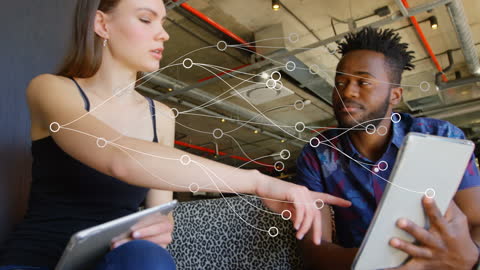 Colleagues Engaging in Technology-Driven Discussion