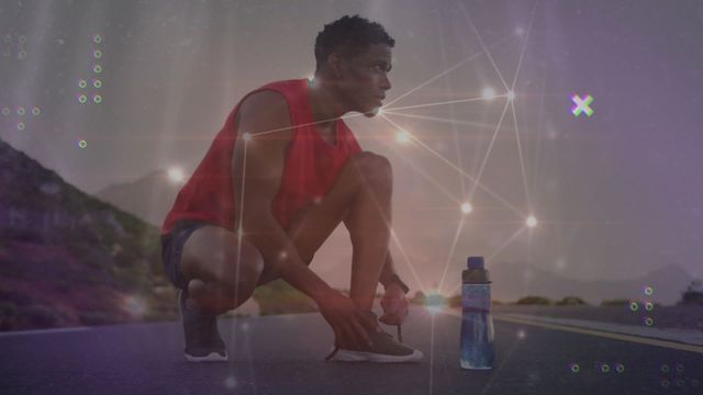 African American man crouches in active preparation for running, set outdoors, near hydration bottle. A dynamic digital network overlay surrounds as virtual technology and sports technology performative junction meet as compelling pop culture athletic experience.