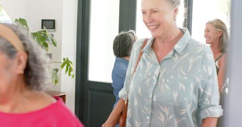Joyful Elderly Friends Sharing Moment Indoors, Diverse Smiling Group