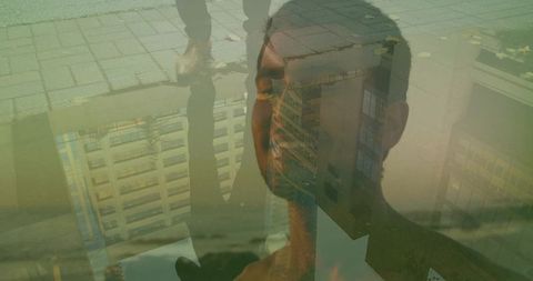 Pondering shirtless man closing eyes in moody urban double-exposure blending with architecture