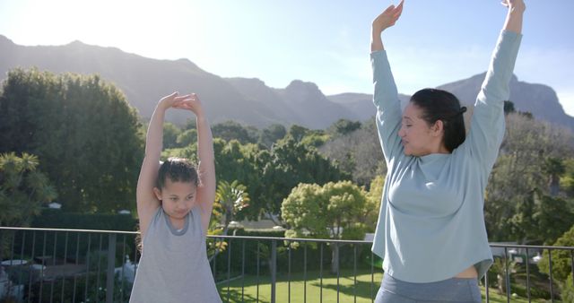 Mother and Daughter Exercising Together in Outdoor Garden - Download Free Stock Images Pikwizard.com