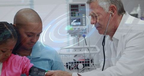 Doctor Examining Young Girl's Blood Pressure in Hospital Room