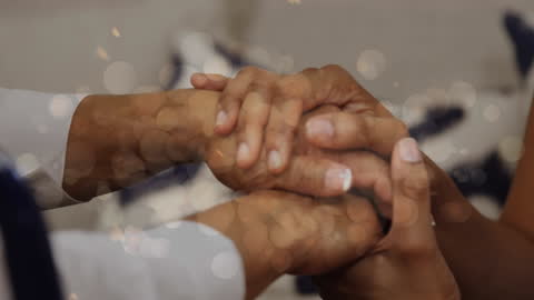Supporting Hands Covered with Gentle Glow of Lights
