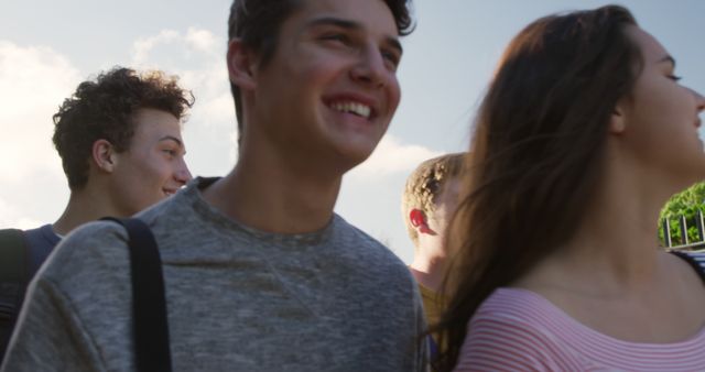 Group of Happy Teenagers Walking Outdoors Together - Download Free Stock Images Pikwizard.com