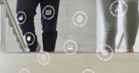 Diverse business professionals and digital technology icons