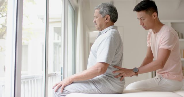 Elderly man receiving physical therapy sessions with assistance from a therapist - Download Free Stock Images Pikwizard.com