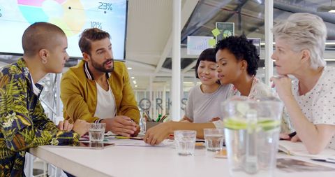 Diverse team in creative office brainstorming together