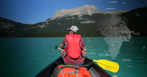 Paddling Canoe on Turquoise Lake with Digital Globe Overlay, Outdoor Adventure Exploration