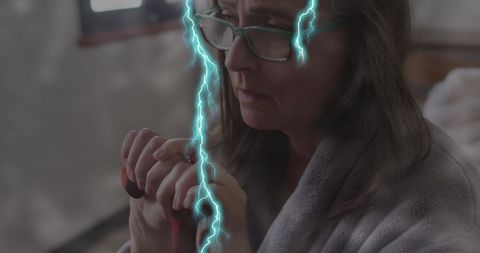 Elderly Woman Reflecting with Digital Lightning Effect