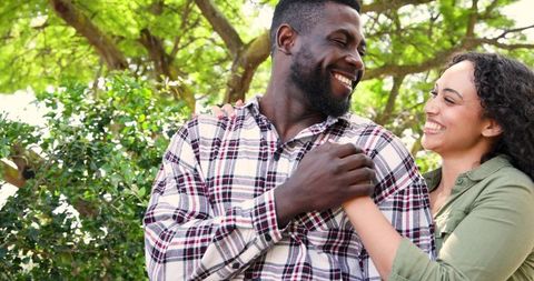 Smiling African American Couple Enjoying Sunny Park Outdoors