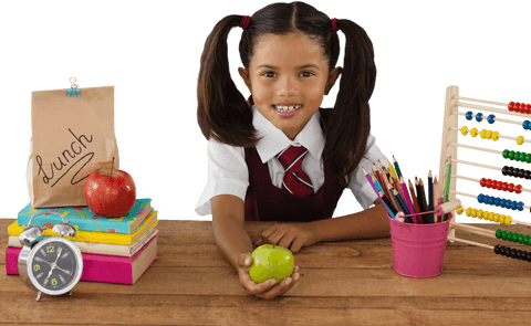 smiling schoolgirl holding transparent green apple at diverse school desk - Download Free Stock Videos Pikwizard.com