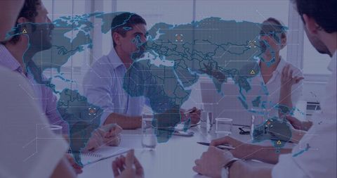 Business team discussing global strategy with holographic world map overlay in boardroom