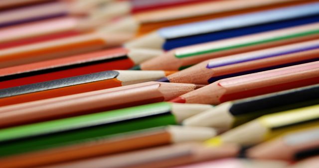 A vibrant array of colored pencils is laid out, showcasing a spectrum of hues and shades for artistic use. These pencils are essential tools for artists, students, and creative enthusiasts to bring their imaginative ideas to life on paper.