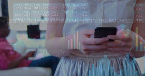 Modern Businesswoman Analyzing Data with Smartphone