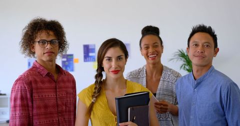 Diverse Creative Team Smiling in Modern Office