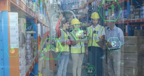 Diverse Warehouse Workers Discussing Using Technology Amidst Holographic Icons