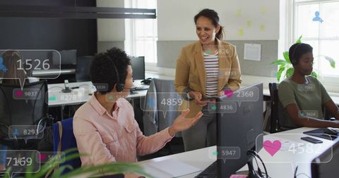 Leading team in open-plan office with headsets, tablet and social media engagement overlays