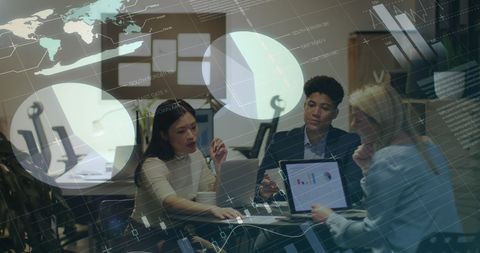 Diverse team collaborating with big data in modern office