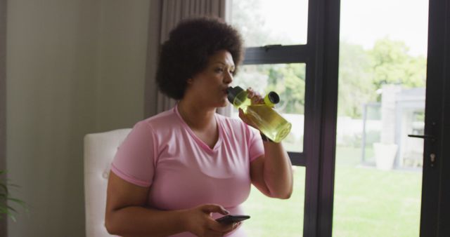 Image of midsection of plus size african american woman in sport clothes preparing for exercising - Download Free Stock Photos Pikwizard.com