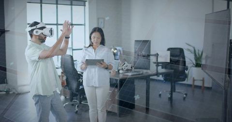 Professionals Engaging with Virtual Reality Technology in Modern Office