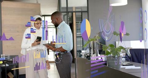 Diverse Professionals Analyzing Digital Graphs in Open Office