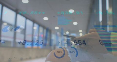 Traveler reviewing charts on smartphone in airport lounge