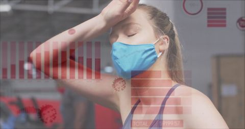 Woman in Gym Wearing Mask Overlaid with COVID-19 Data - Download Free Stock Images Pikwizard.com