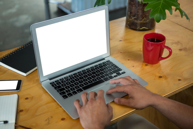 Hands Typing on Laptop with Transparent Screen and Red Mug - Download Free Stock Videos Pikwizard.com