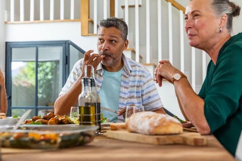 Senior Couple Enjoying Casual Home Meal Together at Dining Table