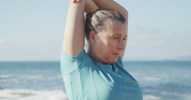 Senior Woman Stretching Outdoors by the Sea - Download Free Stock Images Pikwizard.com