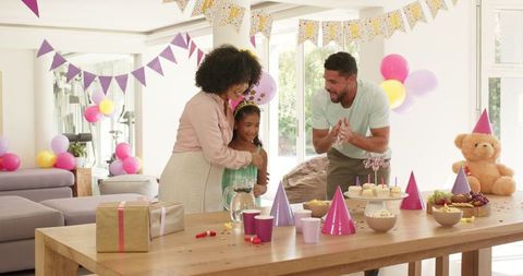 Diverse Family Celebrating Birthday with Joyful Home Decorations