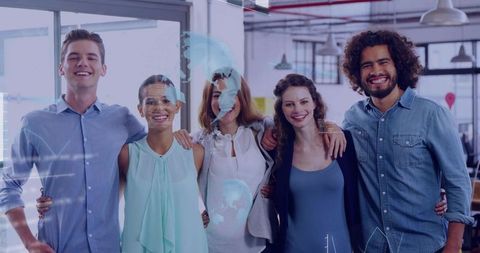 Young diverse team celebrating success in modern office with digital data overlays