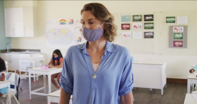 Teacher Wearing Face Mask Observing Young Students in Classroom - Download Free Stock Images Pikwizard.com