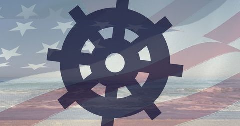 Ship Wheel Over American Flag on Ocean Beach