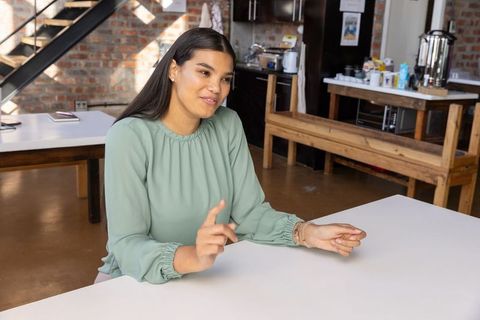 Professional Woman Engaging in Office Discussion