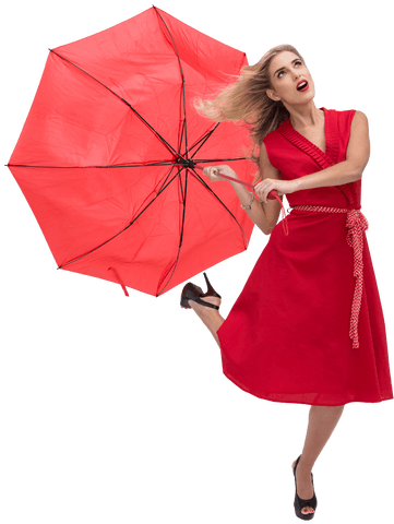 Fashionable woman holding red transparent umbrella with joyful expression