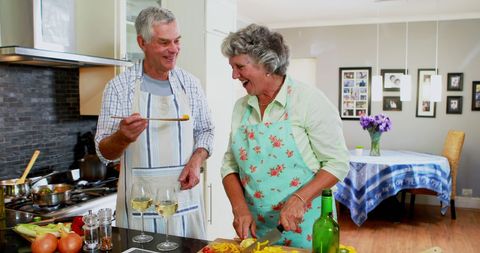 Senior Couple Embracing Joyful Cooking Together in Home Kitchen - Download Free Stock Images Pikwizard.com