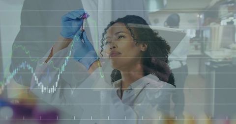 Laboratory researcher holding vial and analyzing sample with data chart overlay