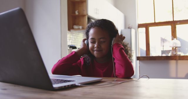 Young Child Enjoying Music with Headphones at Home - Download Free Stock Images Pikwizard.com