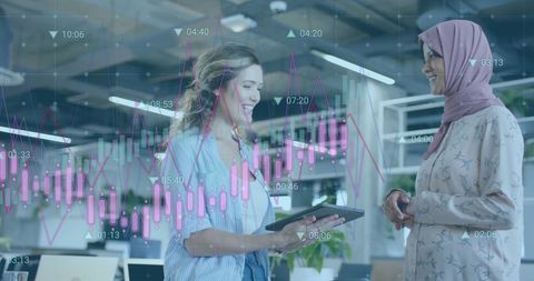 Diverse Colleagues Discussing Digital Data in Modern Office