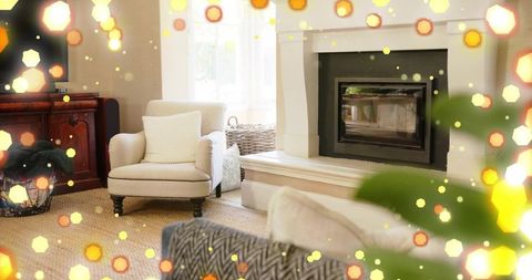 Cozy neutral living room with cream armchair, woven rug and sleek fireplace, hygge decor