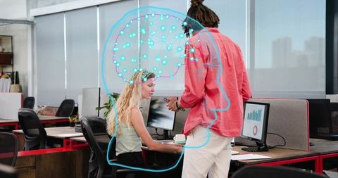Colleagues discussing data and brainstorming with digital brain overlay in open-plan office