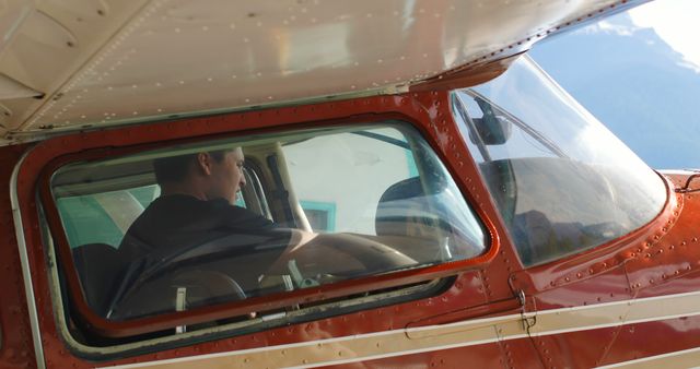 Pilot in Cockpit of Small Passenger Airplane Preparing for Takeoff - Download Free Stock Images Pikwizard.com