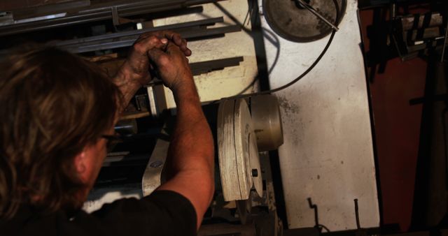 Worker Adjusting Machinery in Industrial Workshop - Download Free Stock Images Pikwizard.com