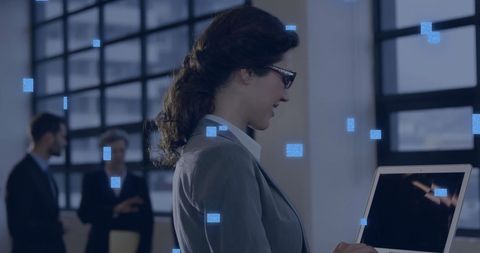 Innovative Woman Leveraging Technology in Modern Office