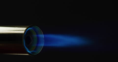 Close-up of Blowtorch Flame Against Dark Background
