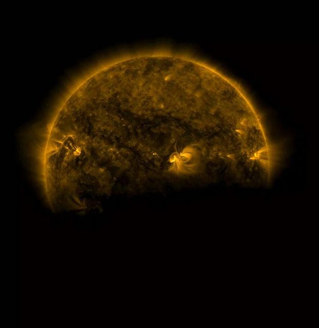 Picture of the Earth partially eclipsing the Sun taken by the Solar Dynamics Observatory in August 2016. Earth’s atmosphere creates a fuzzy edge effect as it blocks the Sun. Useful for educational content on astronomy, astrophotography, space science, celestial events, and for illustrating the Earth's atmospheric impact. Suitable for articles, reports, or presentations on space observations and the Solar Dynamics Observatory's mission.