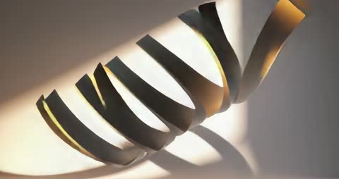 Abstract Metal Coil Artwork Casting Dynamic Shadows