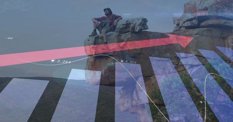 Man Hiking atop Mountain with Superimposed Financial Graphs