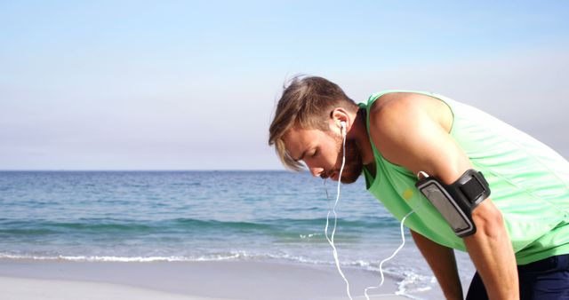 Tired Man Resting on Beach after Workout - Download Free Stock Images Pikwizard.com